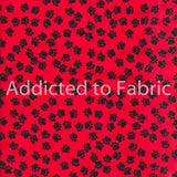 Black Paw Prints on Red Fabric by Hi-Fashion Fabrics,, Puppy Paws